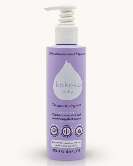 Kokoso organic coconut oil baby lotion bottle on a cream background