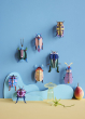 Collection of Studio Roof beetles and insects pictured hung up on a blue coloured wall