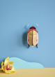 Studio Roof Lemon Fruit Beetle decoration hung up on a blue painted wall