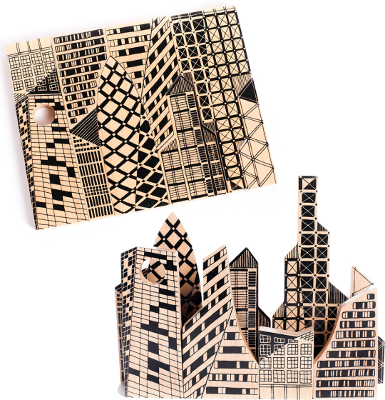 The Bajo City Puzzle is a chunky 9-piece wooden puzzle that can be used to make a striking monochrome cityscape jigsaw, or used to make your own 3D city scene.  