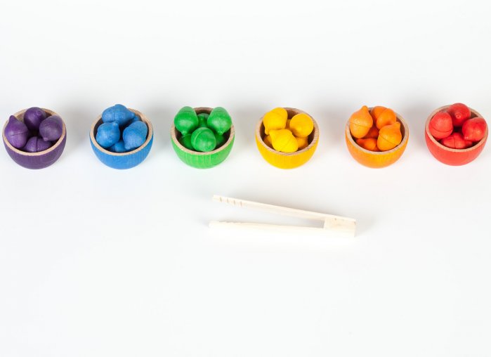 Grapat Wooden Toy Bowls & Acorns Set - 6 rainbow coloured small wooden bowls each with 6 coloured acorns and a set of wooden tweezers. White background.