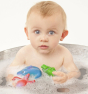 Lanco 100% Natural Rubber Bath Toys - Ocean Play Set including an octopus, crab and dolphin toy in a tin bath with baby