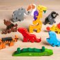Pieces of the Alphabet Jigsaw number zoo puzzle scattered on a wooden floor