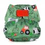 Baba + Boo eco-friendly reusable Newborn Nappy in Farmyard print on a green nappy with red tractors, outline prints of trees, pigs and chicks, a red velcro closure tab on a white background