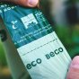 Close up of hands tearing the Beco Pets compostable dog waste bags