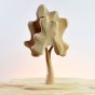 Bumbu eco-friendly and plastic free medium birch tree with a natural wood finish on a wooden table in front of a grey background