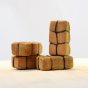 Bumbu eco-friendly childrens wooden haystack toy blocks stacked on a light wooden background