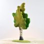 Close up of the Bumbu eco-friendly solid wooden birch tree toy on a white wooden background