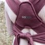 Close up of the straps and logo of the close caboo cotton blend baby carrier in the burgundy colour