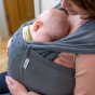 Close up of baby sleeping in the close caboo cotton blend baby carrier in the olive colour