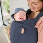 Close up of smiling baby inside the close caboo organic baby carrier in the blueberry colour