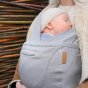 Close up of small baby sleeping in the close organic caboo carrier in the porpoise colour