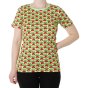 Woman stood on a white background wearing the DUNS Sweden organic cotton short sleeve top in the paradise green radish print