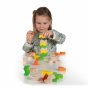 Girl playing with the Erzi eco-friendly wooden stacking geo shape blocks on a white background