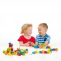 Two children playing with the Erzi sustainably sourced wooden threading block game on a white background
