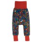 Frugi woodland friends parsnip pants with red roll up ankle cuffs and waistband rolled out on white background