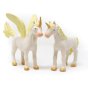 Green Rubber Toys natural rubber golden unicorn and pegasus toys stood on a white background
