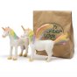 Green Rubber Toys eco-friendly natural rubber pegasus and unicorn toys stood on a white background in front of their brown paper bag