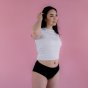 Hey Girls Basic Brief - Black Period Pants worn by a person wearing a white top against a pink background