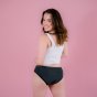 Hey Girls Essential Bikini - Grey Period Pants worn by a person wearing a white top against a pink background