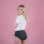 Hey Girls Mid Waist Grey Reusable Period Pants worn by a blonde person with a white top against a pink background