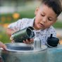 Boy filling up a Klean Kanteen 12oz insulated tkwide camo drinks bottle from a metal water fountain