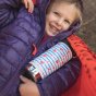 Close up of a girl holding the klean kanteen stainless steel 12oz twist cap drinks bottle in the heart stripe colour