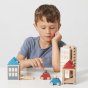 Child playing with the plastic free Lubulona summerville stacking town set on a white table