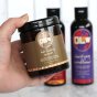 Olew Hair Healing Remedy in a brown glass pot, with Olew conditioner in the background 