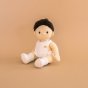 Olli ella childrens dinkum doll toy sat on a beige background wearing the dress up care clothing set 