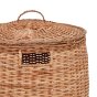 Close up of the woven lid on the Olli Ella natural rattan laundry bin on a white background
