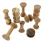 Papoose handmade wooden spool block toys scattered on a white background