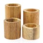 4 Papoose hand carved stacking wooden Montessori tubes on a white background