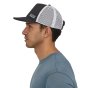 Man stood wearing the Patagonia eco-friendly duckbill trucker hat on a white background