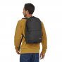 Man stood backwards wearing the Patagonia eco-friendly adults everyday arbor zip pack on a white background