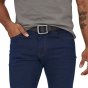 Close up of a man wearing jeans and a top, showing the Patagonia eco-friendly tech web belt 