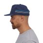 Patagonia Line Logo Ridge Stripe Funfarer Cap from the side in New Navy worn by a person wearing a grey top on a white background