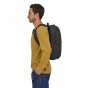 Man wearing the Patagonia large arbor zip pack on a white background
