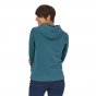 Woman stood backwards wearing the Patagonia blue womens P6 logo hoody on a white background