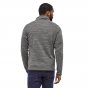 Man stood backwards wearing the Patagonia mens insulated thermal winter sweater jacket on a white background