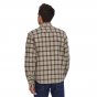 Man stood backwards wearing a Patagonia organic cotton mens fjord flannel patterned shirt on a white background
