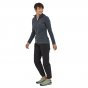 Woman stood wearing the Patagonia thermal R1 air hoodie on a white background