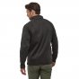 Man standing backwards wearing the Patagonia black knit 1/4 zip jumper on a white background
