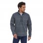 Man wearing the Patagonia recycled polyester better sweater 1/4 zip on a white background