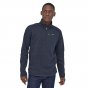 Man wearing the Patagonia 100% recycled polyester knit new navy better sweater on a white background