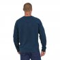 Man stood backwards wearing the eco-friendly organic cotton Patagonia tidepool blue classic crew sweatshirt on a white background