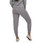 Woman facing backwards on a white background wearing the Patagonia salt grey ahnya pants