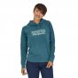 Woman stood wearing the organic cotton Patagonia p6 logo hoody in abalone blue on a white background
