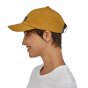 Picture of model wearing the trad cap showing the side view. Picture background is white.