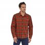 Man stood wearing the Patagonia eco-friendly 100% organic cotton fjord flannel shirt in hot ember red on a white background